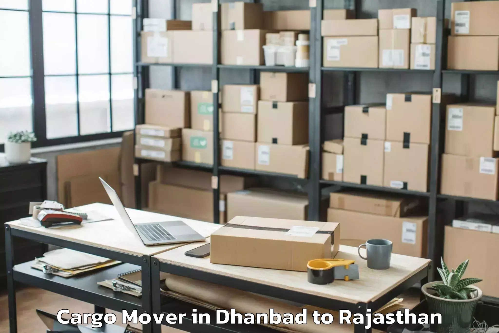 Reliable Dhanbad to Kaman Cargo Mover